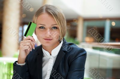 Closeup portrait of cute young business woman smiling while hold