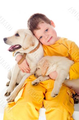 Handsome Young Boy Playing with His Dog Against White Background