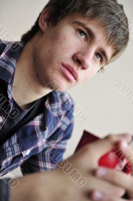 Happy young handsome man at home