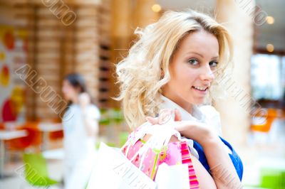 Happy shopping woman with bags
