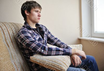 Happy young handsome man at home