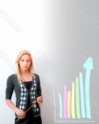 Young business teacher showing growing profit with graph on whit
