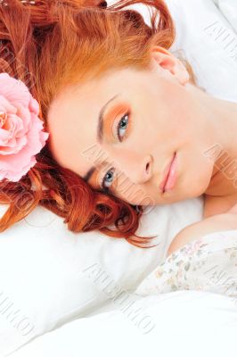 Closeup portrait of young beautiful caucasian woman with red hai