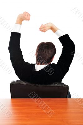 Portrait of a handsome young business man leaning 