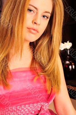 Closeup portrait of young pretty woman doing makeup and hairstyl