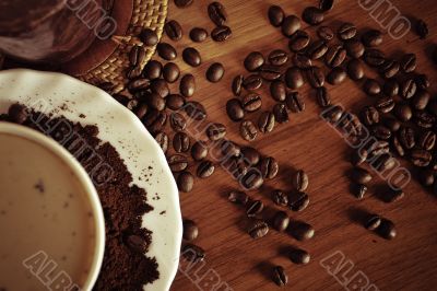 warm cup of coffee on brown background