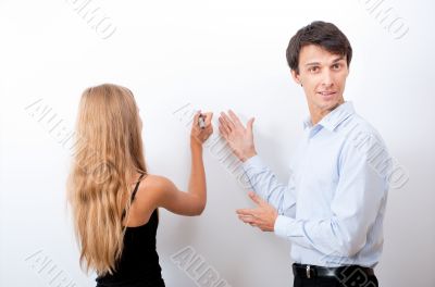 Closeup of adult teacher with student - explaining something