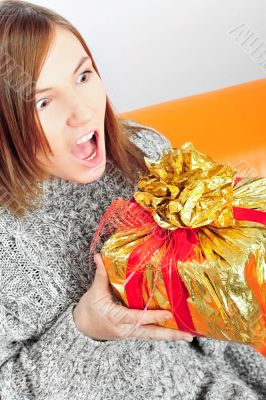Closeup portrait of young beautiful woman wearing domestic warmi