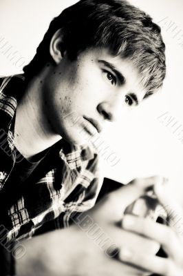 Happy young handsome man at home