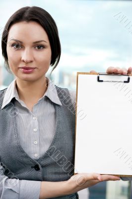 Portrait of business woman holding blank reports and looking at 