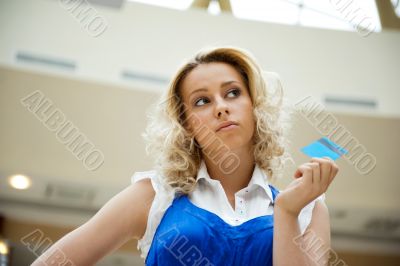 Beautiful shopping woman holding a credit card