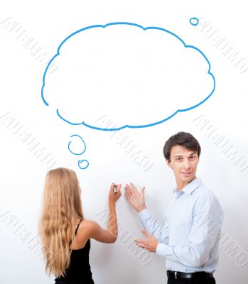 Confident adult teacher helping to students  in school classroom