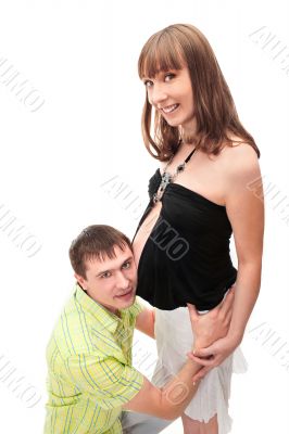 Image of pregnant woman touching her belly with hands