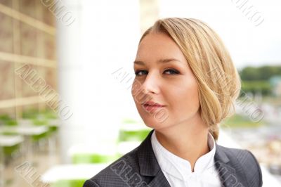 Closeup portrait of cute young business woman smiling