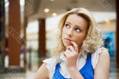 Portrait of a beautiful thoughtful woman smiling intdoors