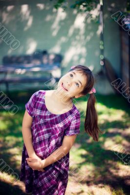 Artistic lifestyle photo of cute little girl outdoor at summer p