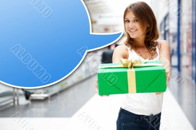 Portrait of young excited pretty woman standing inside shopping 