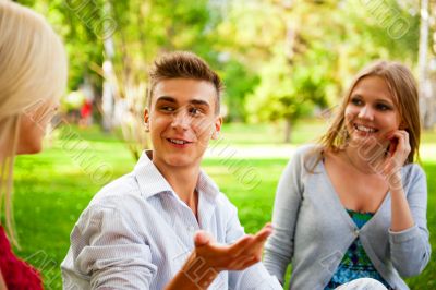 Portrait of three young teenagers laughing and having fun togeth