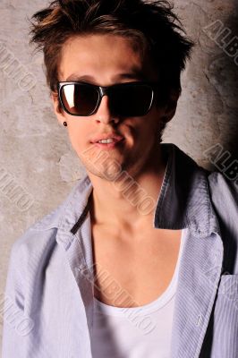 Closeup of young, handsome man thinking