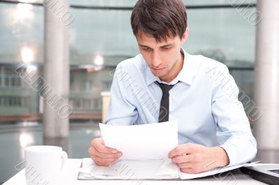 Portrait of a business man working at his office