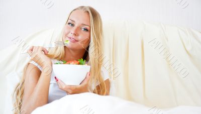 Closeup portrait of pretty caucasian woman having a healthy diet