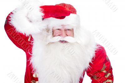 Traditional Santa Claus looking for children and holding his han