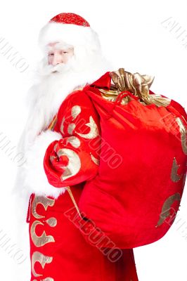Santa Claus standing up on white background with his bag full of