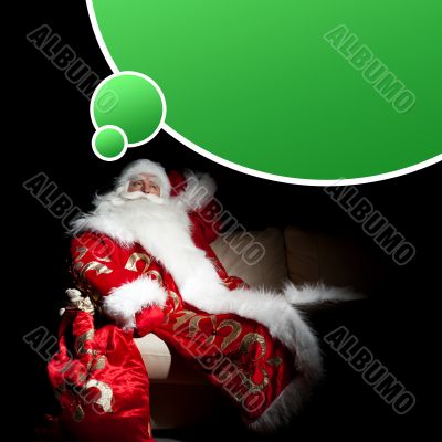 Santa sitting with a sack indoor at dark night room