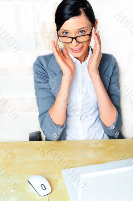 Beautiful business woman thinking about something while working 