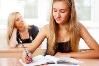 Portrait of a young group of students paying attention in class.
