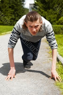 Businessman getting ready for race