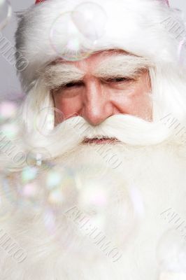 Santa Claus portrait smiling isolated over a white background an