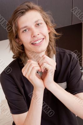 Happy young man falling in love in morinig at home
