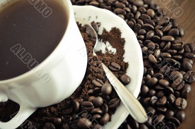 warm cup of coffee on brown background