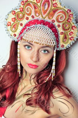 Closeup portrait of pretty young woman with red hairs