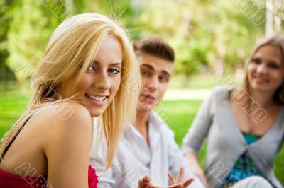 Portrait of three young teenagers laughing and having fun togeth