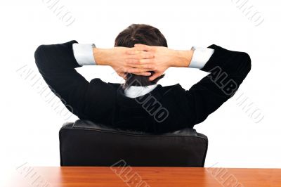 Closeup portrait of young businessman from the back. Sitting wit