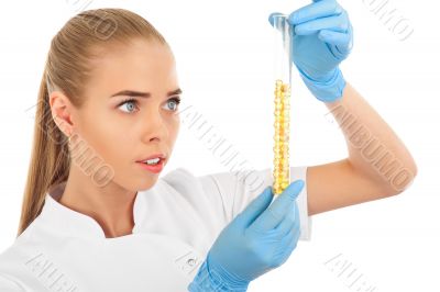 Isolated scientist woman in lab coat with chemical glassware. 