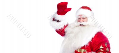 Santa Claus pointing his hand isolated over white.