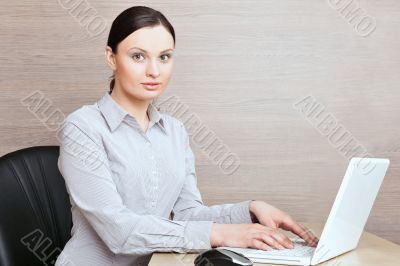 Portrait of a beautiful young businesswoman on the computer.