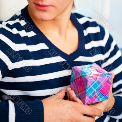Portrait of young man inside shopping mall sitting relaxed on co