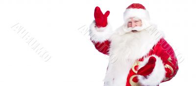 Santa Claus pointing his hand isolated over white.