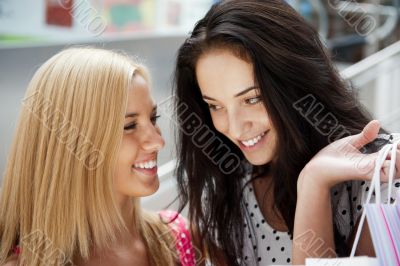 Group of beautiful shopping women with bags and smiling