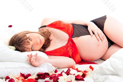 Image of pregnant woman touching her belly with hands