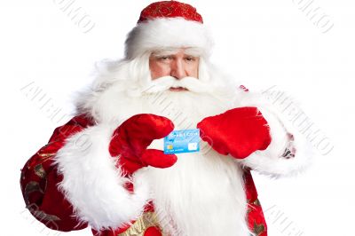 Traditional Santa Claus holding and sowing credit card while giv