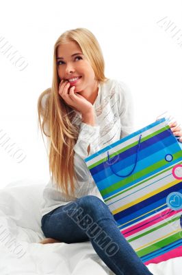 beautiful young blond woman on the bed at home