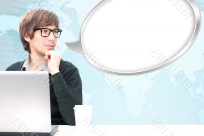 Portrait of young businessman communicating with people through 