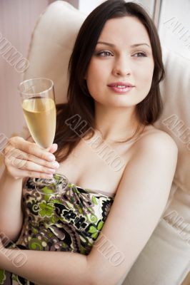 Portrait of smiling beautiful young brunette woman at home