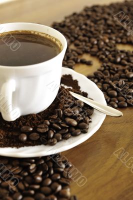 warm cup of coffee on brown background