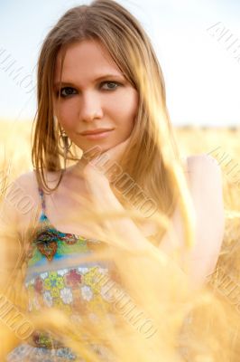 Young happy woman in field